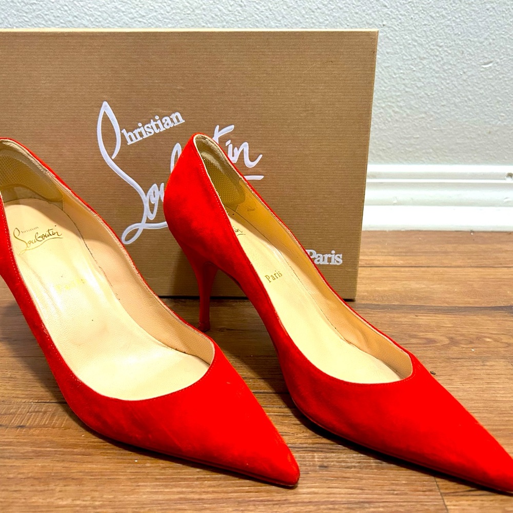 Red suede Louboutin pumps